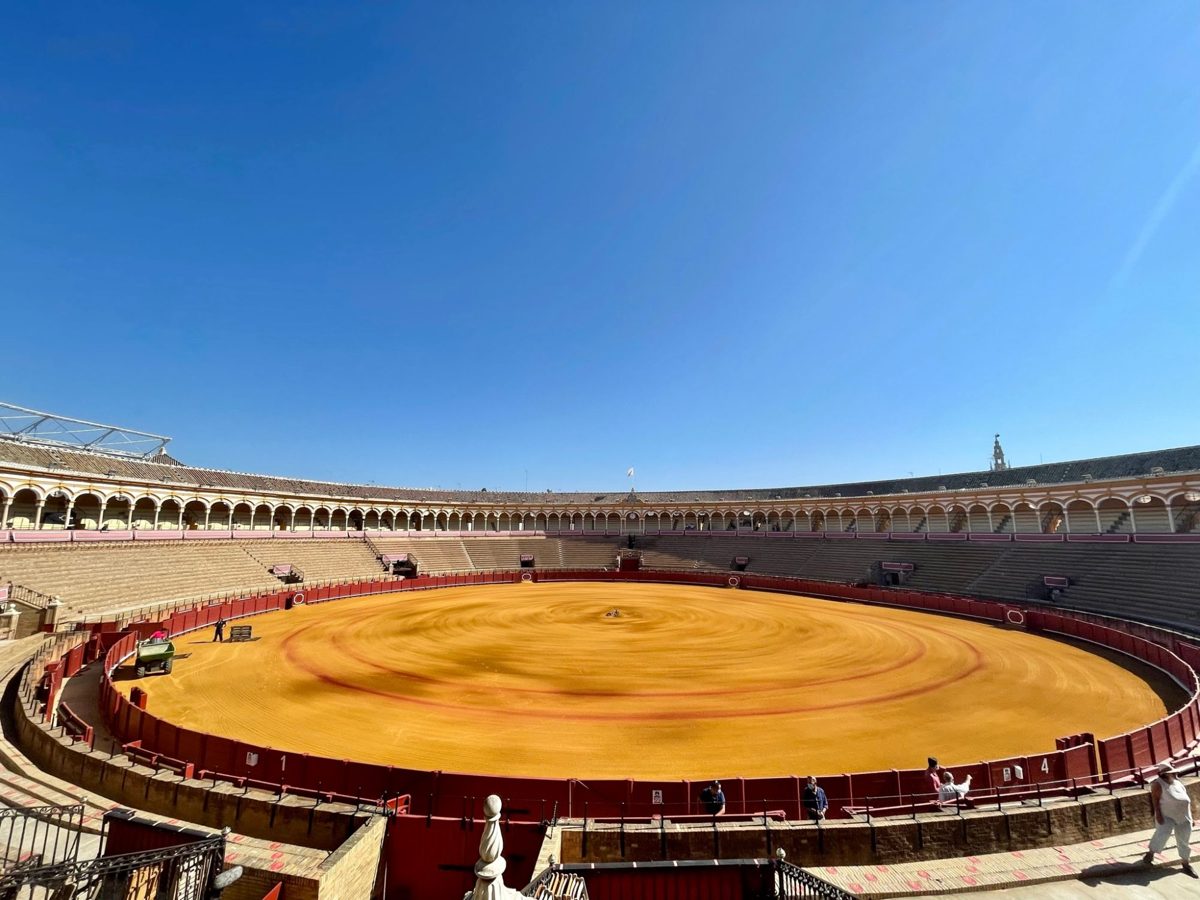 The Plaza de Toros de Sevilla with raked orange sand